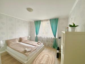 A bed or beds in a room at Apartments in complex ATIA RESORT