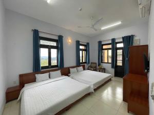 Postel nebo postele na pokoji v ubytování Resort Hoa Sim Da Lat