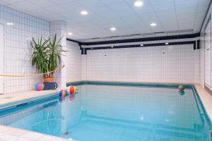 a large swimming pool with at Villa Welschen in Oerlinghausen