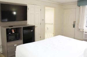 Postel nebo postele na pokoji v ubytování Quality Inn Aurora Denver
