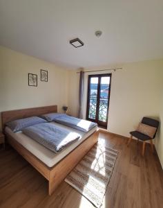 Postel nebo postele na pokoji v ubytování Apartmány Zaky