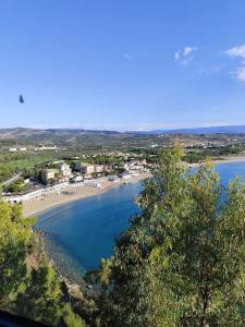 a view of a beach and a body of water at Luna Convento Copanello B&B in Stalettì