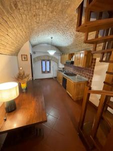 an overhead view of a kitchen with a table at Casa dell Erbe in San Gimignano +8 photos