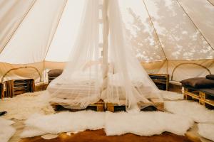 a wedding veil is hanging in a tent at Lawendowa Osada in Przywidz +286 photos