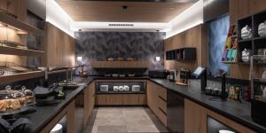 a large kitchen with a large counter in a room at Hotel Lamtana in Ischgl