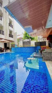 Bazén v ubytování The Tandibayang Hotel & Villas nebo v jeho okolí