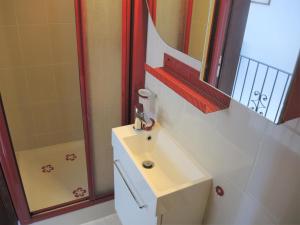 a bathroom with a sink and a shower at Casa Gialla by Fewotessin in Verscio +35 photos