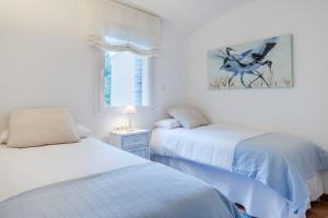 Ένα ή περισσότερα κρεβάτια σε δωμάτιο στο Flateli Begur +21 φωτογραφίες