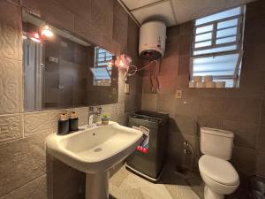 a bathroom with a sink and a toilet at Sunset homes in Downtown Cairo in Cairo +25 photos