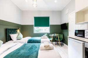 The Chapter Hotels - Finsbury Park客房内的一张或多张床位