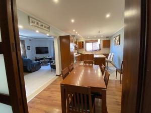 a dining room and living room with a dining table at Elegant & Cozy House in Prime St Julians by SF Homes in St Julian's