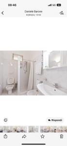 a bathroom with a sink and a tub and a toilet at Scala center apartment with kitchen in Scala