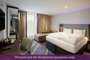 Postel nebo postele na pokoji v ubytování Premier Inn Wien City Hauptbahnhof