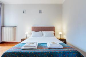 Giường trong phòng chung tại La Grande Casa - City Center