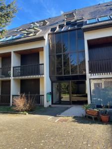 a house with a lot of windows on it at Duplex Vielle-Aure in Vielle-Aure