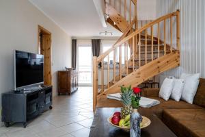 Μια τηλεόραση ή/και κέντρο ψυχαγωγίας στο Appartement-Kapitaensdeck-415