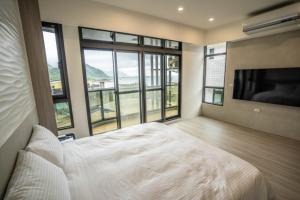 Letto o letti in una camera di 眺浪島民宿