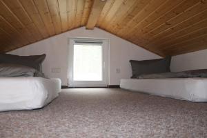 En eller flere senge i et værelse på Ferienhaus Cottbus