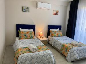Postel nebo postele na pokoji v ubytování Dalaman Pansiyon & Family rooms