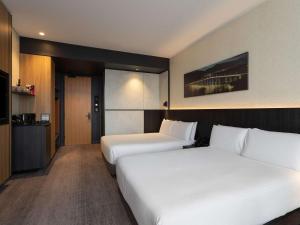 Postel nebo postele na pokoji v ubytování Mövenpick Hotel Hobart