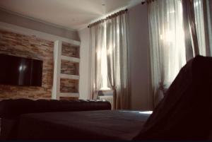 A television and/or entertainment centre at B&B San Paolo Sweethome