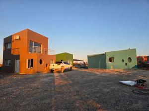 a truck parked in front of a building at El Oceano in Puerto Madryn