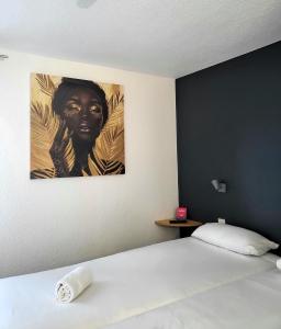 Postel nebo postele na pokoji v ubytování Fasthôtel Limoges Nord - FH Confort