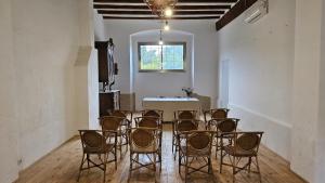 a dining room with chairs and a table and a window at MAS DE BERNIS - Masia in L'Aldea +71 photos