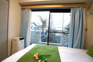 Postel nebo postele na pokoji v ubytování Room 204 Nishi-Shinjuku Gochome 9 minutes walk 40 square meters Sleeps up to 6 people