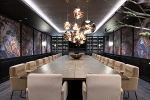 a conference room with a large table and chairs at Hotel Restaurant Silberberg in Wolfsberg