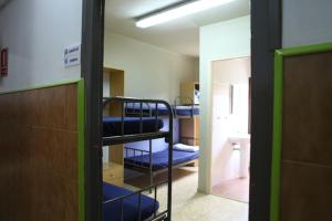Postel nebo postele na pokoji v ubytování Casa de Colònies Vall de Boí - Verge Blanca + 24 fotografií