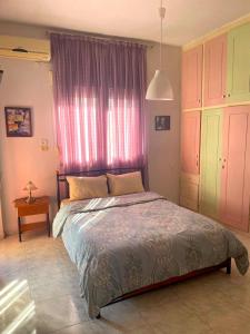 Postel nebo postele na pokoji v ubytování Friendly Family House