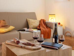 a living room with wine glasses and a couch at Apartment MB4 Loggia by Interhome in Moriani Plage
