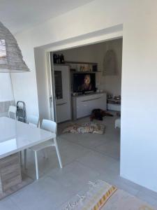 a living room with a dog laying on the floor at Casa Isabell Con Piscina Privata in San Teodoro