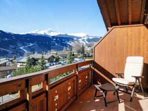 a balcony with a view of the mountains at Apartment Chalet Pfingstrose by Interhome in Grindelwald
