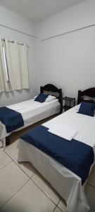 Ένα ή περισσότερα κρεβάτια σε δωμάτιο στο Apartamento no centro de Castanhal