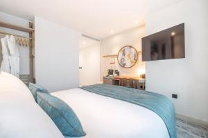 Postel nebo postele na pokoji v ubytování Dorsett Hotel Canary Wharf