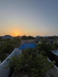 a view of the sunset from the roof of a building at Samia House in Jambiani