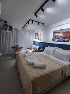 Postel nebo postele na pokoji v ubytování RN Studio Apê 506 + 37 fotografií