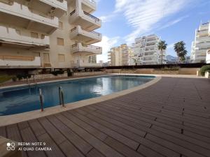 Bazén v ubytování Xeracsol III Solo Familias Serviplaya!!! nebo v jeho okolí