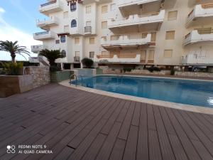 Bazén v ubytování Xeracsol III Solo Familias Serviplaya!!! nebo v jeho okolí
