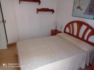 Postel nebo postele na pokoji v ubytování Xeracsol III Solo Familias Serviplaya!!!