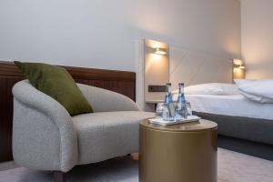 Ein Bett oder Betten in einem Zimmer der Unterkunft Insel-Hotel Heilbronn