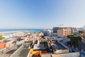 an aerial view of a city with the ocean at Wow Waterfront Apartment in Bari