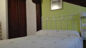 Postel nebo postele na pokoji v ubytování Pasaje San Jorge