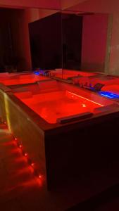 a room with a dj set up with red lights at Duomo Luxury Suite Catania in Catania