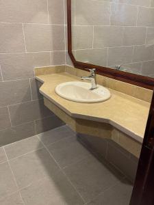 a bathroom with a sink and a mirror at Nubia Island View Dahab in Dahab