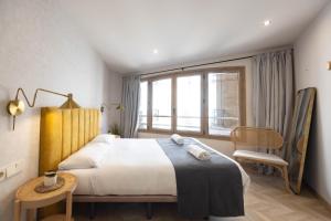 a bedroom with a large bed and a window at Apartamento Turístico Royal, by CartagenaSpain in Cartagena