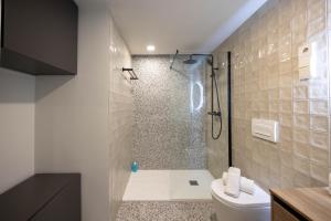 a bathroom with a shower and a toilet at Apartamento Turístico Royal, by CartagenaSpain in Cartagena +17 photos