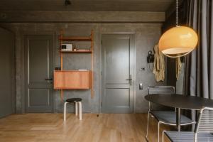 a dining room with a table and chairs at SCALA by Valletta Vintage in Valletta